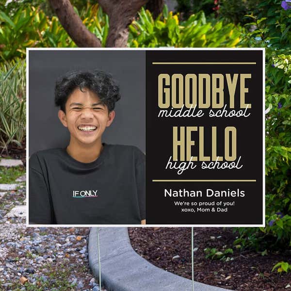 Goodbye middle school graduation yard sign displayed next to pavement