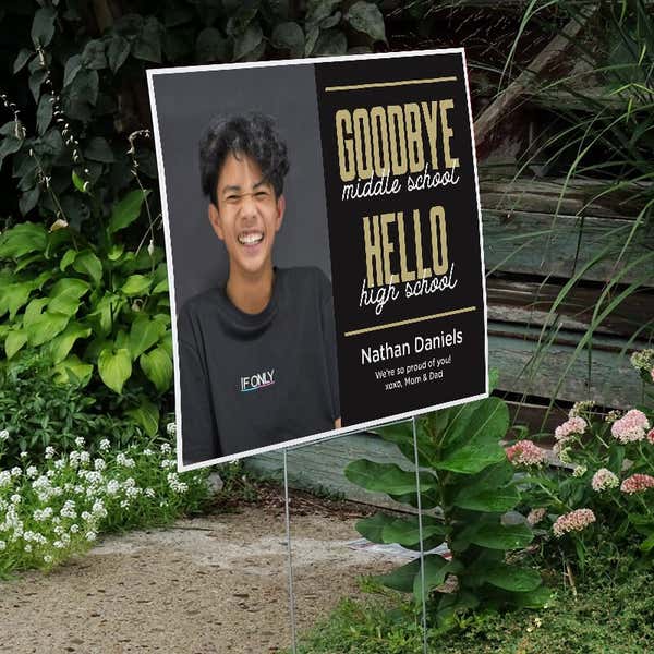 Goodbye middle school graduation yard sign displayed next to stairs