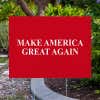 Maga yard sign next to pavement