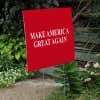 Maga yard sign next to stairs