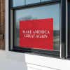 Maga yard sign in a window
