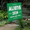 Aliens - Human Aren't Real Yard Sign Next to Stairs