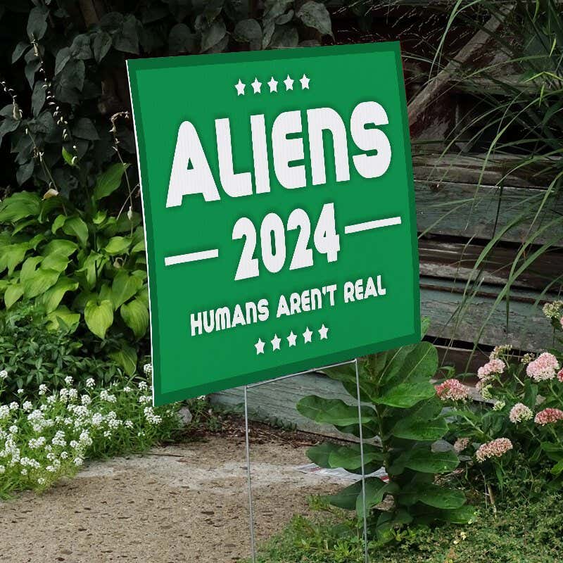 Aliens - Human Aren't Real Yard Sign Next to Stairs