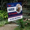 Custom Circle Photo Funny Political Yard Sign Next to Stairs