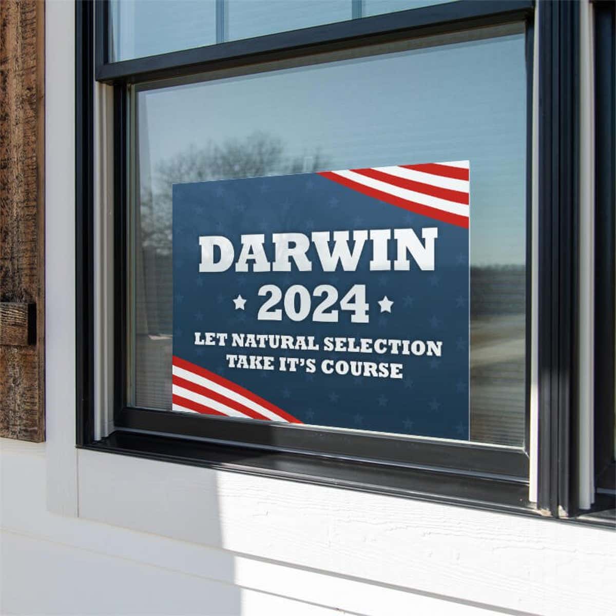 Darwin Funny Political Yard Sign in a Window