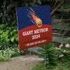 Giant Meteor Funny Political Yard Sign Next to Stairs