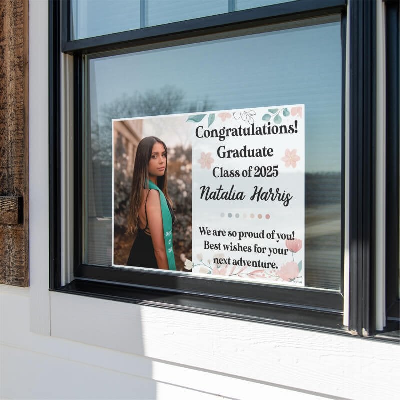 Floral Design and Note Graduation Yard Sign displayed in a window
