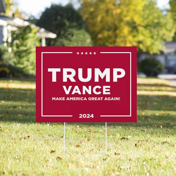 Trump Vance Red Yard Sign in a sunny yard