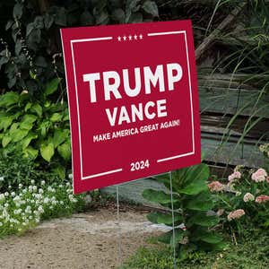 Trump Vance Red Yard Sign next to stairs