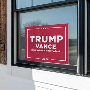 Trump Vance Red Yard Sign in a window