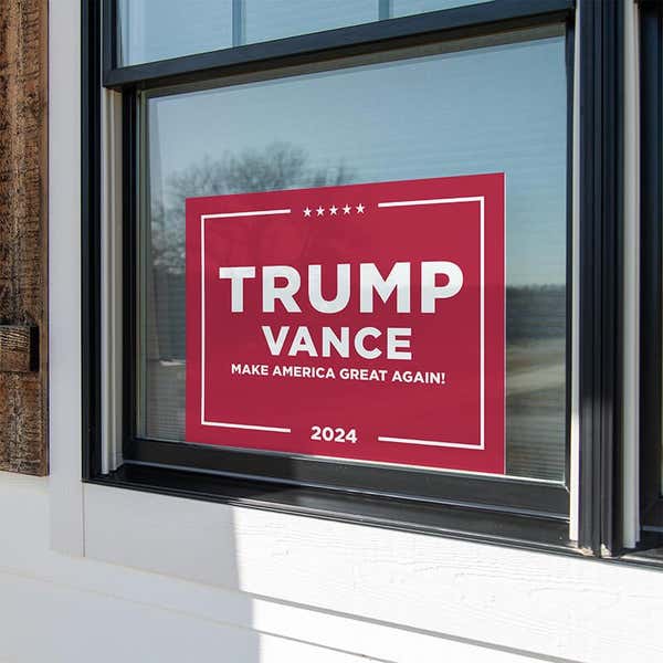 Trump Vance Red Yard Sign in a window
