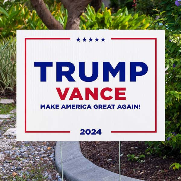 Trump Vance White Yard Sign next to pavement