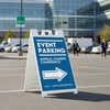 An event parking A-frame sign for an annual leaders conference in a parking lot 