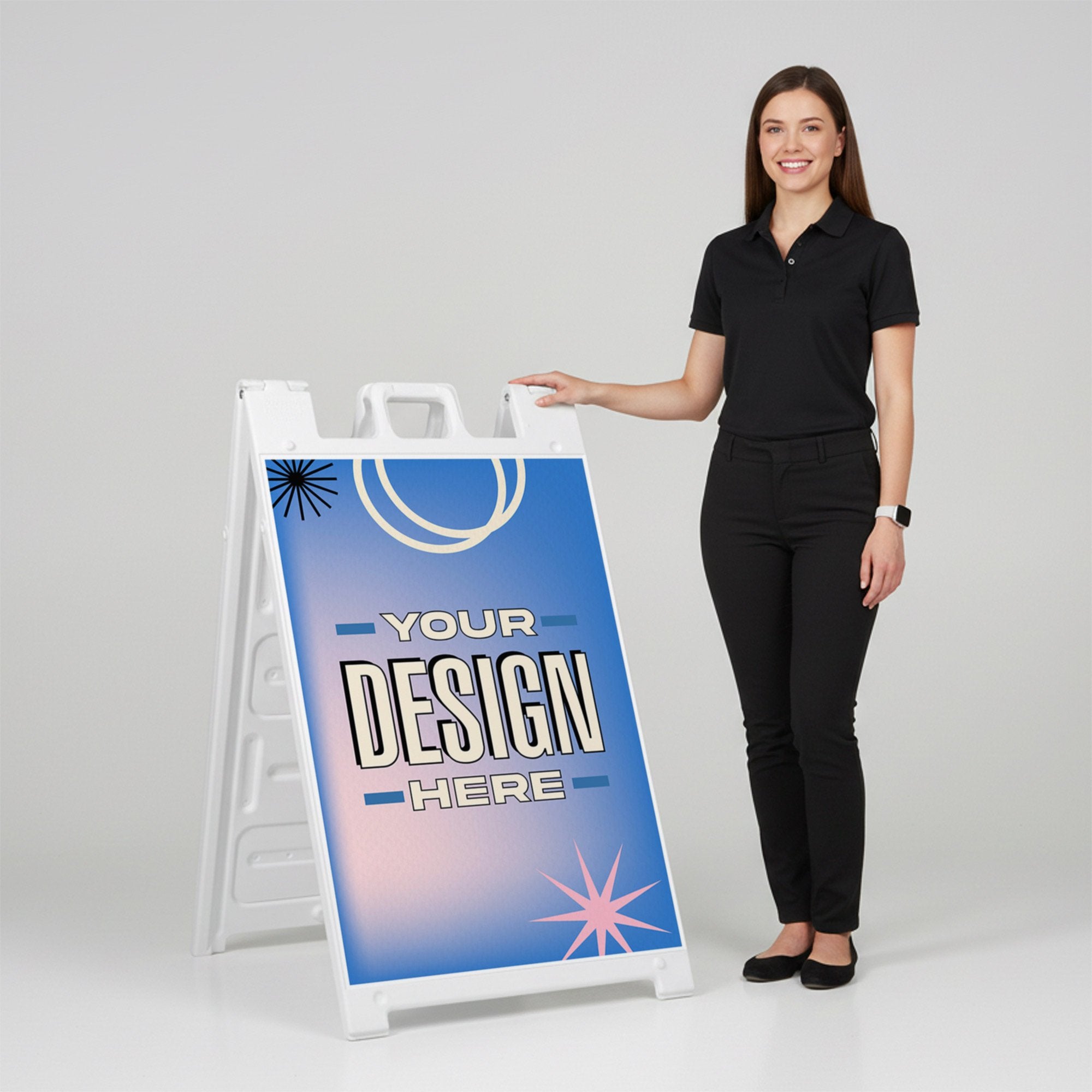 A woman standing next to an A-frame sign with her hand on the top of the sign A woman standing next to an A-frame sign with her hand on the top of the sign