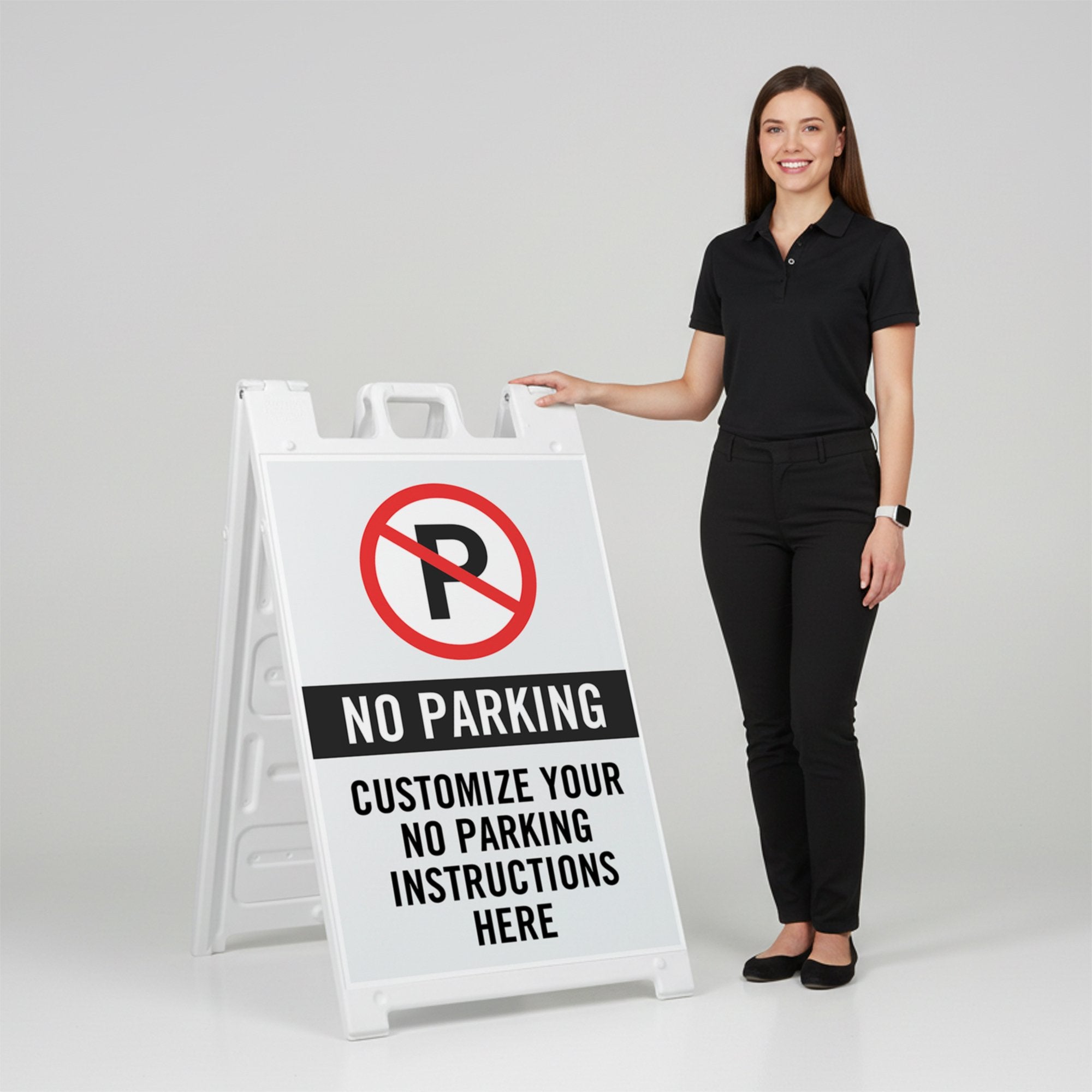 A woman standing next to the no parking sidewalk sign with her hand on the top of the sign