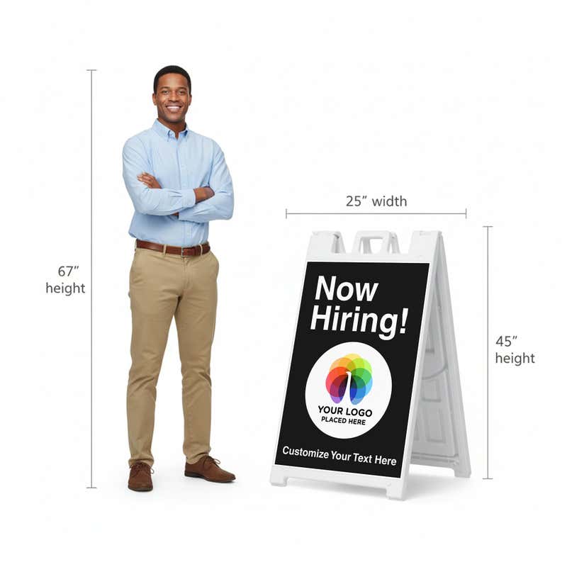 A 67-inch tall man standing next to the 45-inch tall A-frame to show the height comparison