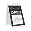 A We Are Open sandwich board sign for a coffee and tea shop