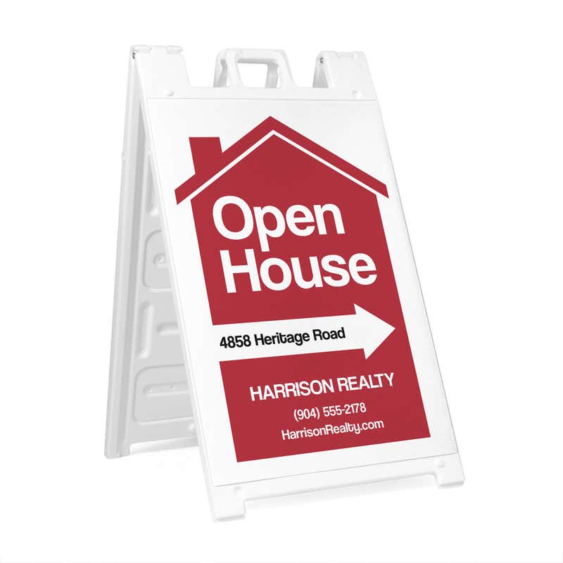 An open house sandwich board sign hosted by a realty company 