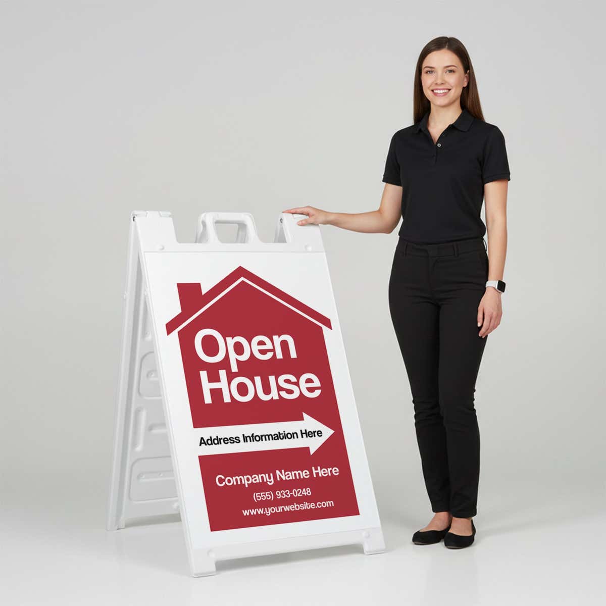 A woman standing next to an open house A-frame sign with her hand on the top of the sign