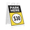 The side angle of the park here sandwich board sign