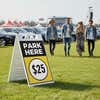 A $25 park here sandwich board displayed at a festival