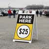 A $25 park here sandwich board displayed near a stadium 