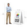A 67-inch tall man standing next to the 45-inch tall A-frame to show the height comparison