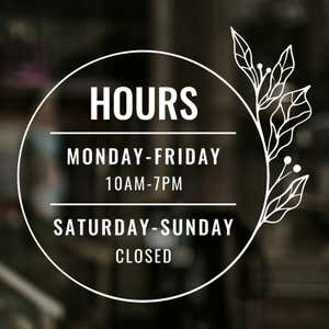 Custom Business Hour Sign with Floral Design displayed on a window