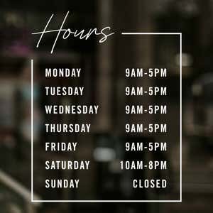 Modern business hours decal displayed on a store window