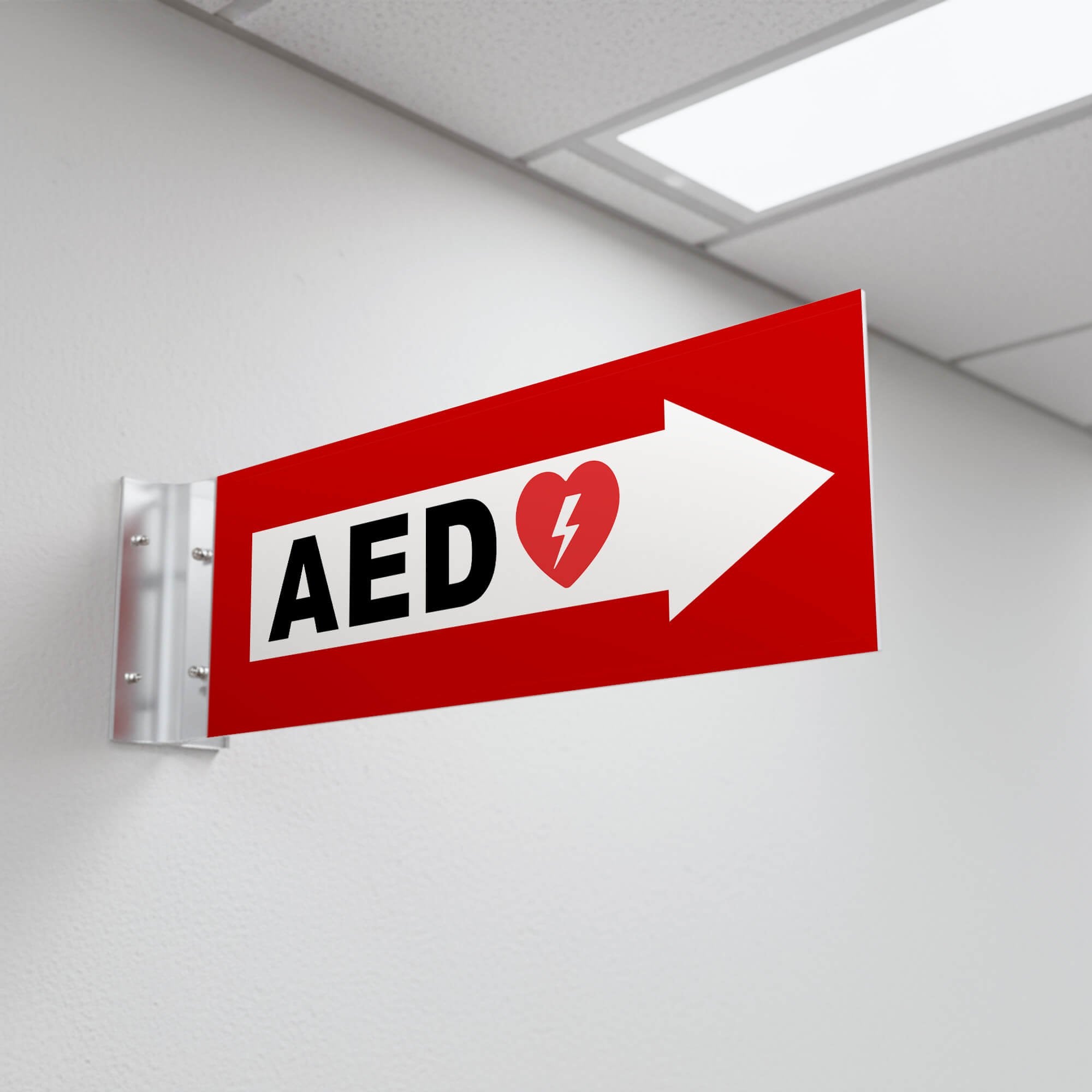 Red projecting AED sign in a hallway
