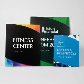 Three sizes of the modern twist ADA sign lined up next to each other