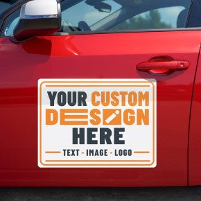 A custom car magnet on the side of a red car