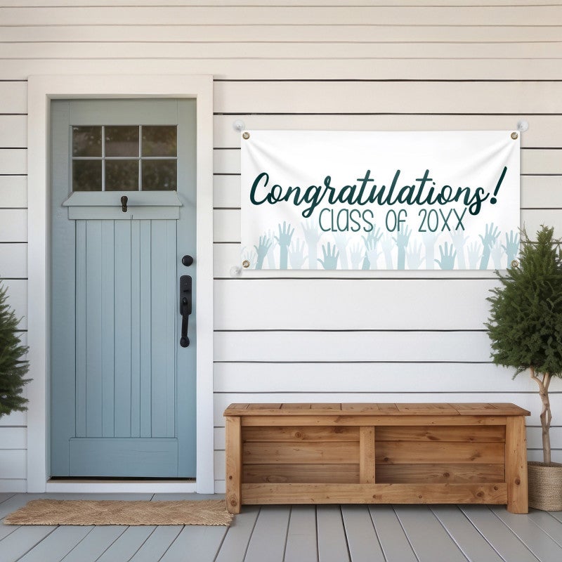Congratulations Cheers Graduation Banner hanging on a house