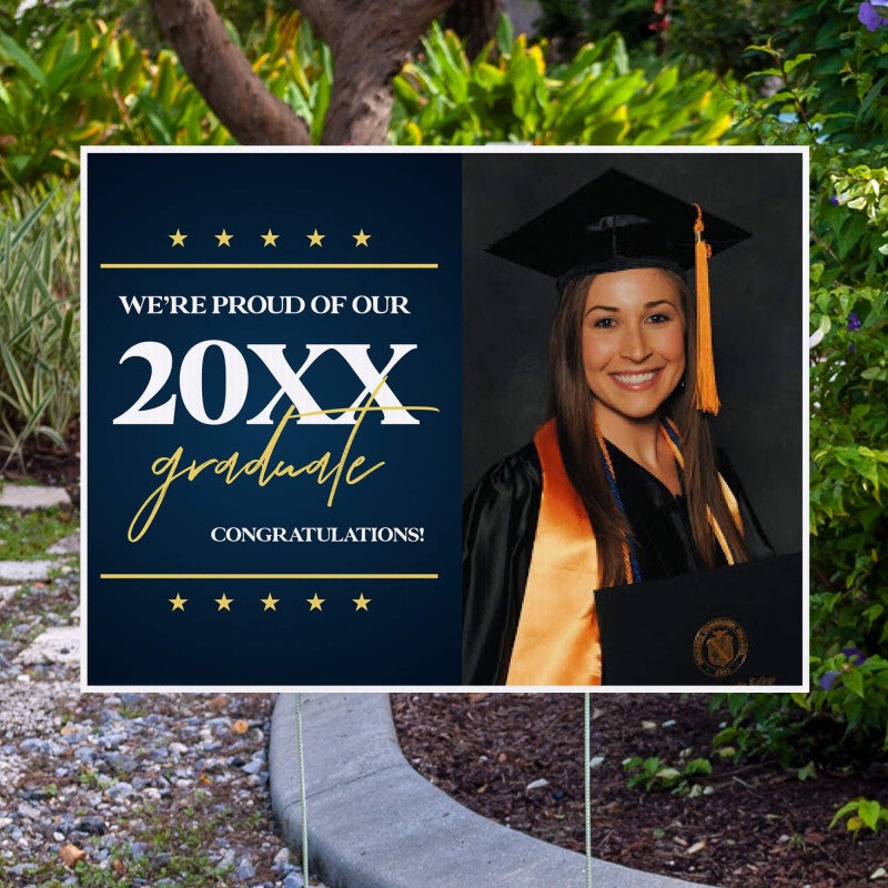 Star and Script custom graduation yard sign displayed in front of a fence