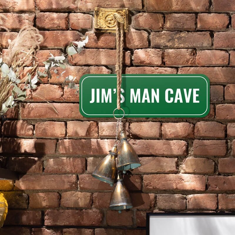 Custom green sign that reads “Jim’s Man Cave” in white text, wall sign for personal spaces