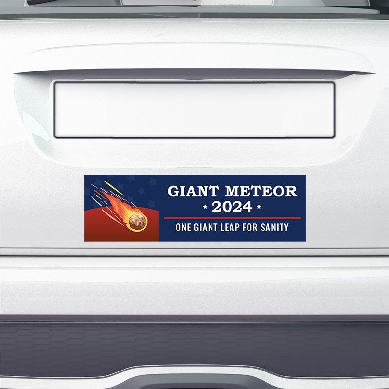 Giant Meteor Bumper Sticker on the bumper of a white car
