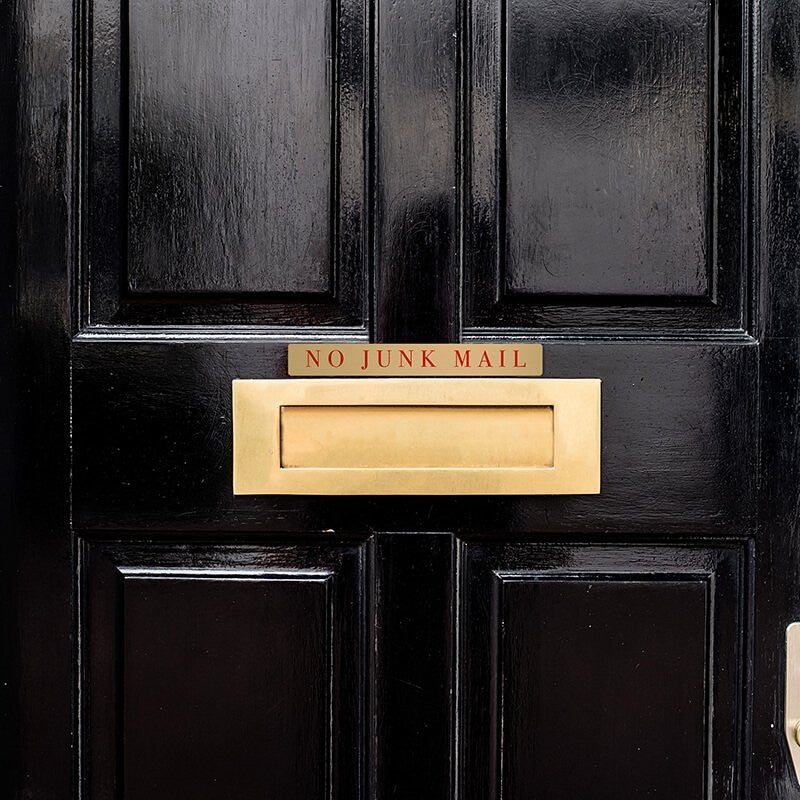 1x8 printed brass sign displayed on a door