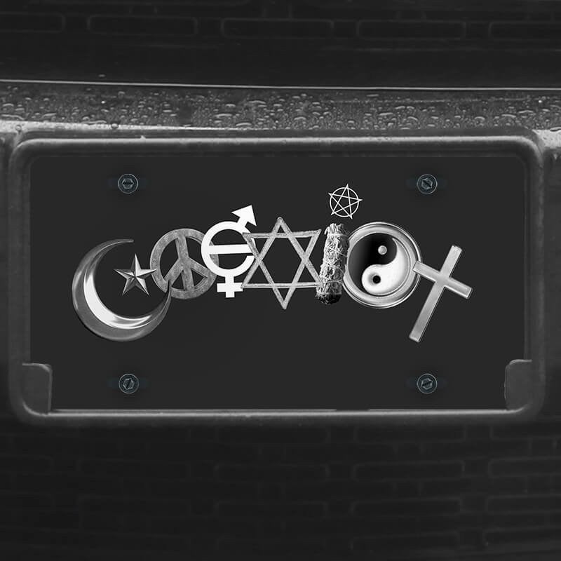 A close up of the Coexist front license plate on a black car