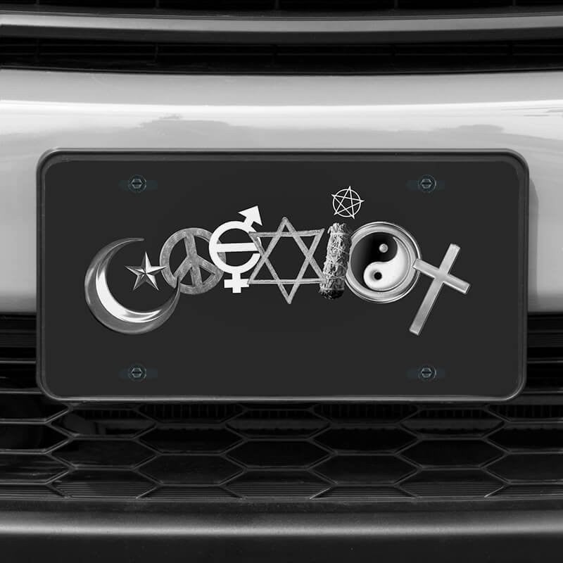 A close up of the Coexist front license plate on a white car