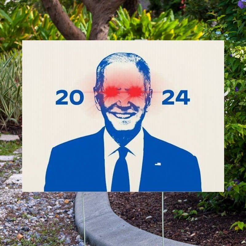 Dark Brandon Yard Sign Next to Pavement