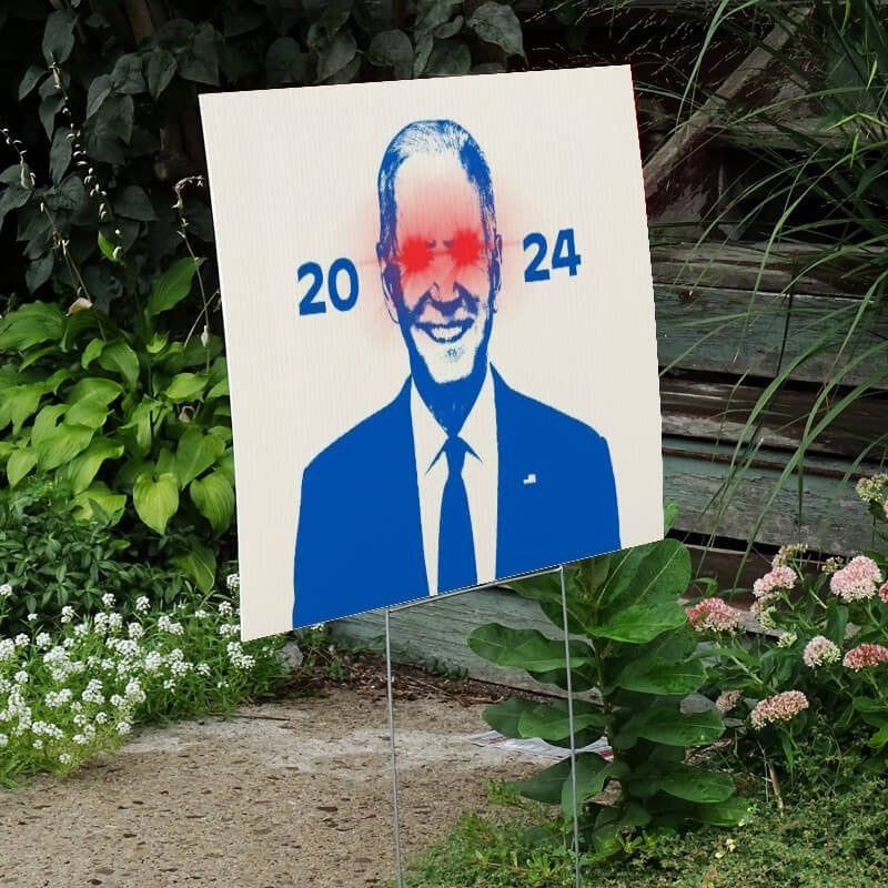 Dark Brandon Yard Sign Next to Stairs