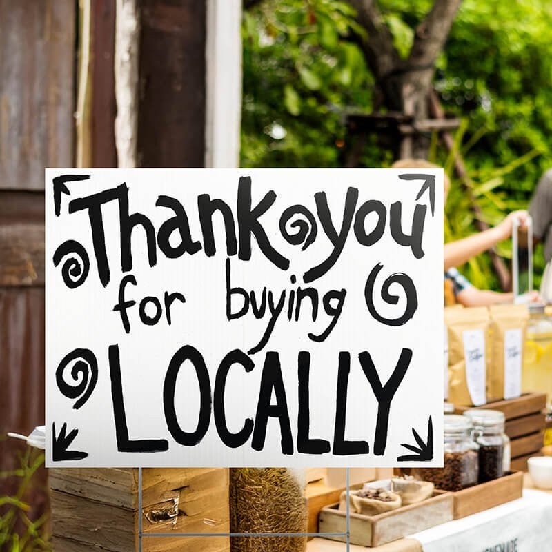 A custom made yard sign written in marker for a local vendor