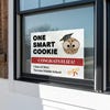 graduation yard sign displayed in a window