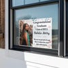 Floral Design and Note Graduation Yard Sign displayed in a window