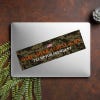 Camo MAGA Bumper Sticker on a closed laptop