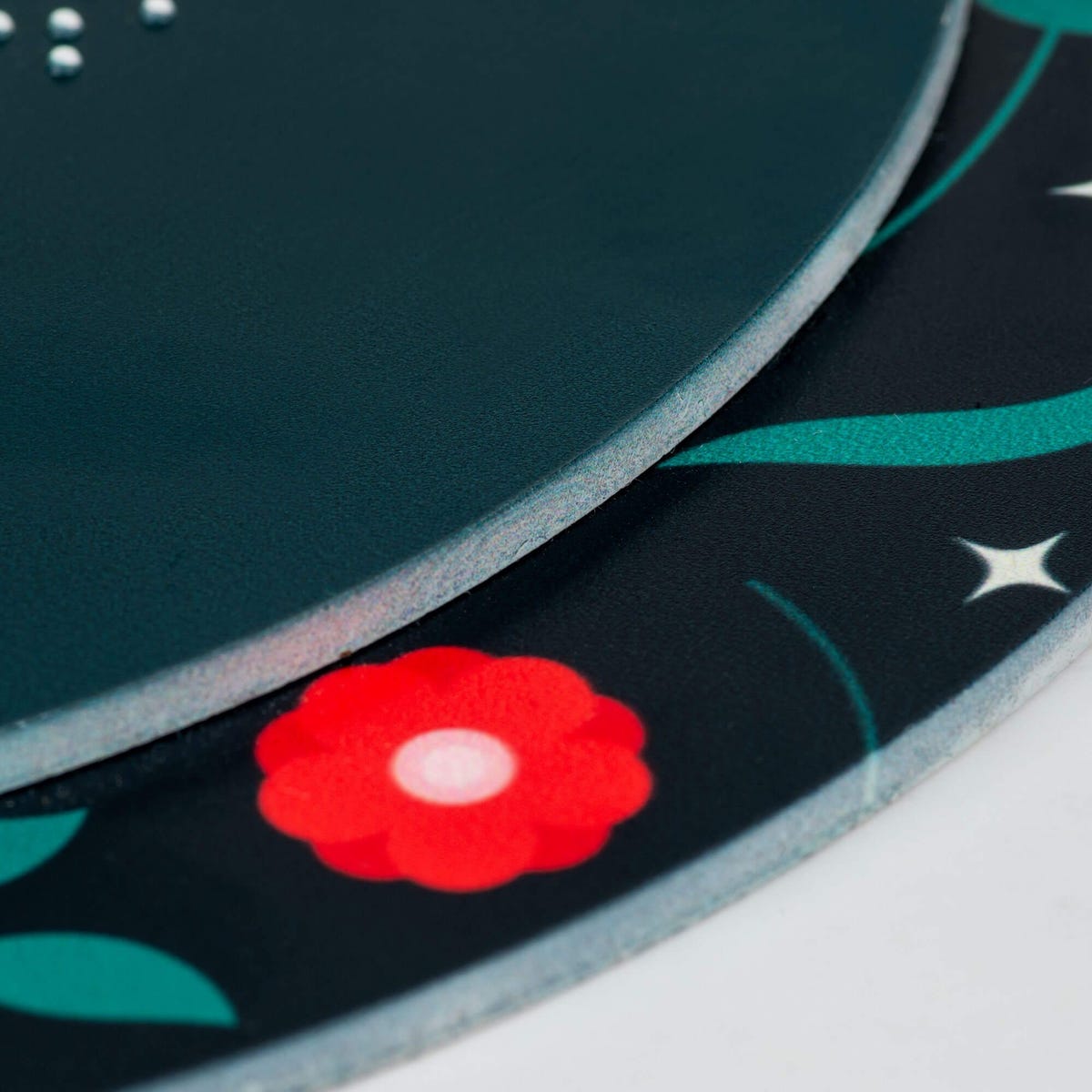 A close-up on the two layers of the round ADA sign