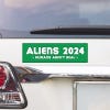 Aliens - Humans Aren't Real Bumper Sticker above a white car's tail light