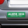 Aliens - Humans Aren't Real Bumper Sticker on the bumper of a gray car