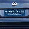 Barbie and Ken bumper sticker on a gray car