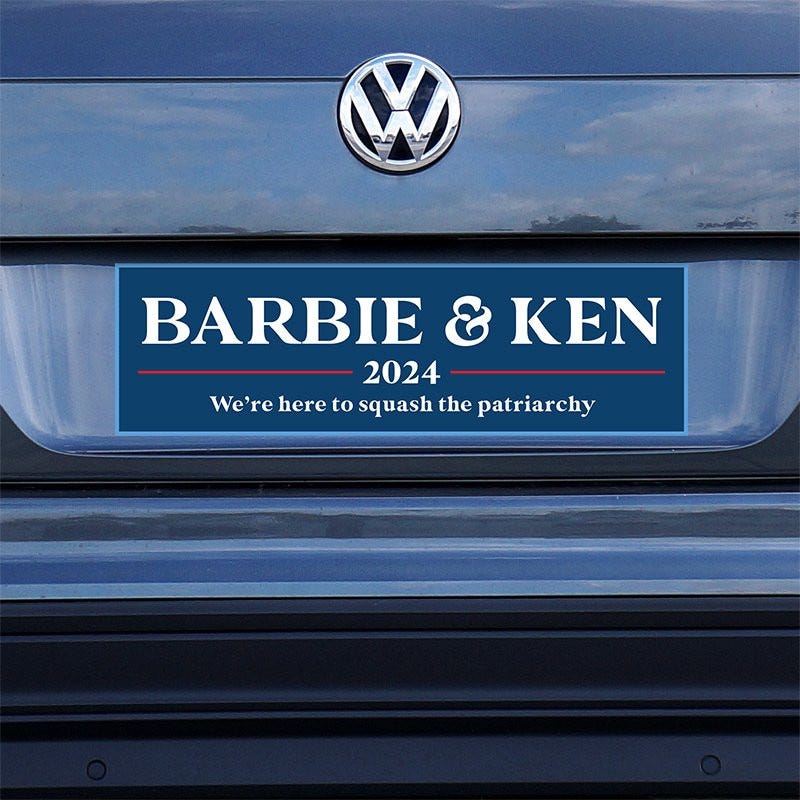 Barbie and Ken bumper sticker on a gray car